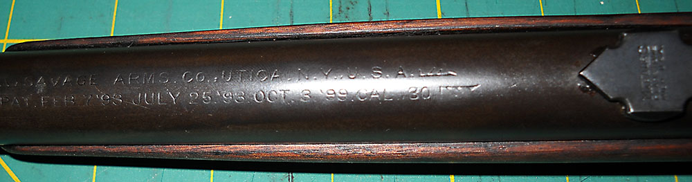 detail view of Savage 99 barrel top roll stamping